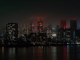 City skyline at night with skyscrapers