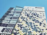 Modern office building under bright sky