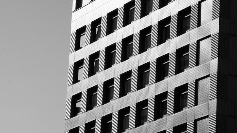 Modern office building under bright sky