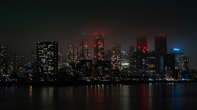 City skyline at night with skyscrapers